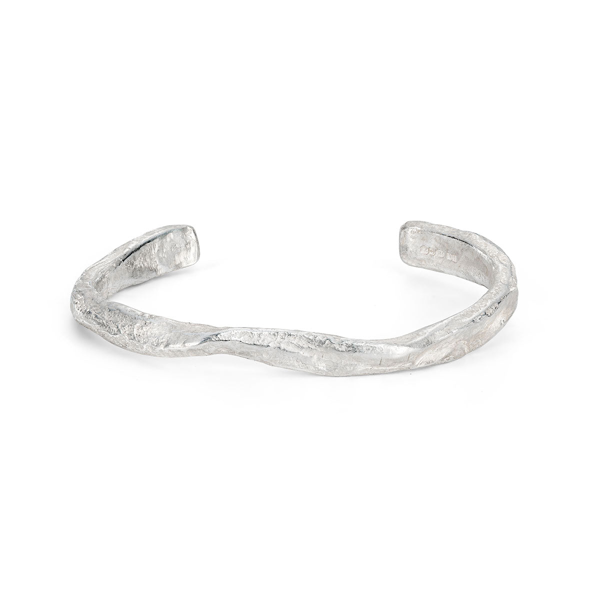 Ruggedly tactile, this sculptural stirling silver cuff looks carved from weathered ocean rock. By Emily Nixon.