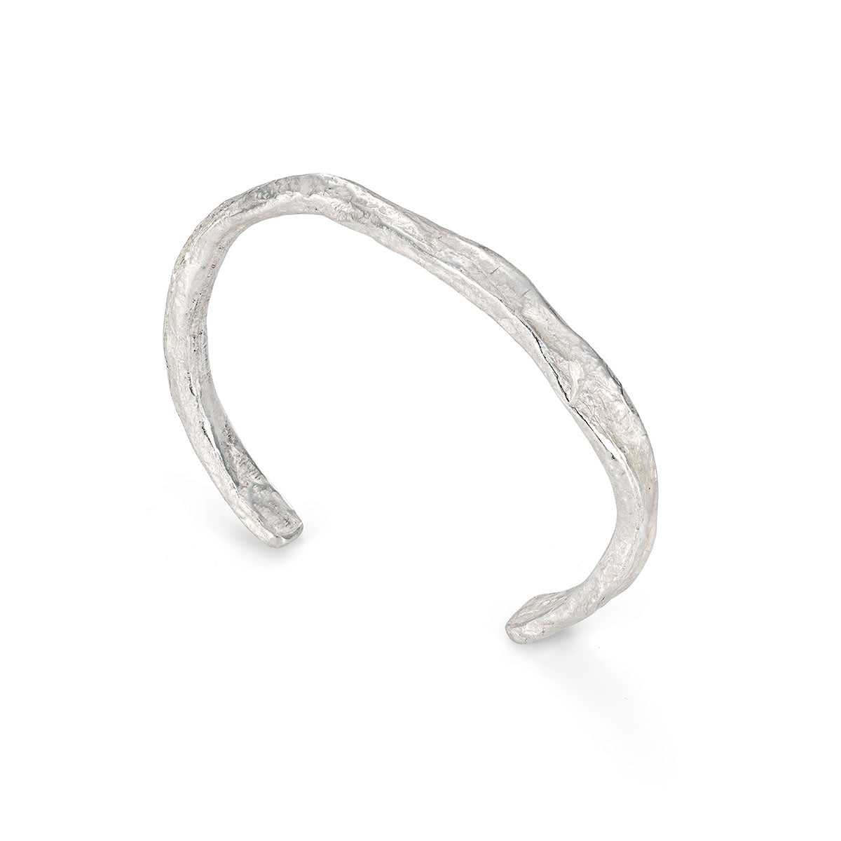 Ruggedly tactile, this sculptural stirling silver cuff looks carved from weathered ocean rock. By Emily Nixon.
