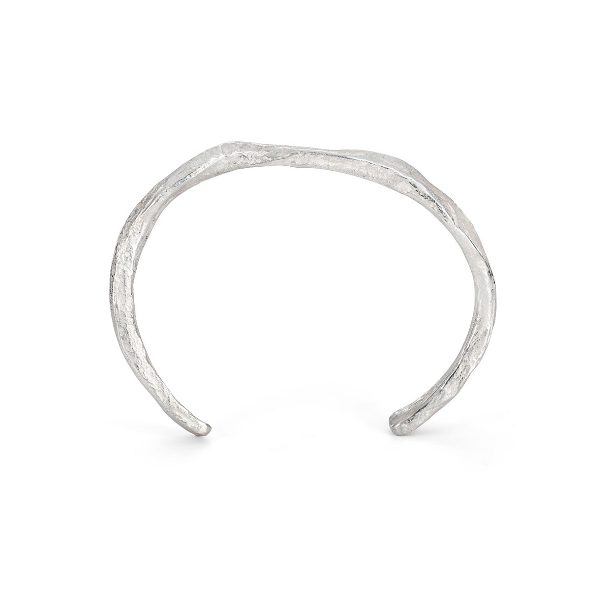 Ruggedly tactile, this sculptural stirling silver cuff looks carved from weathered ocean rock. By Emily Nixon.