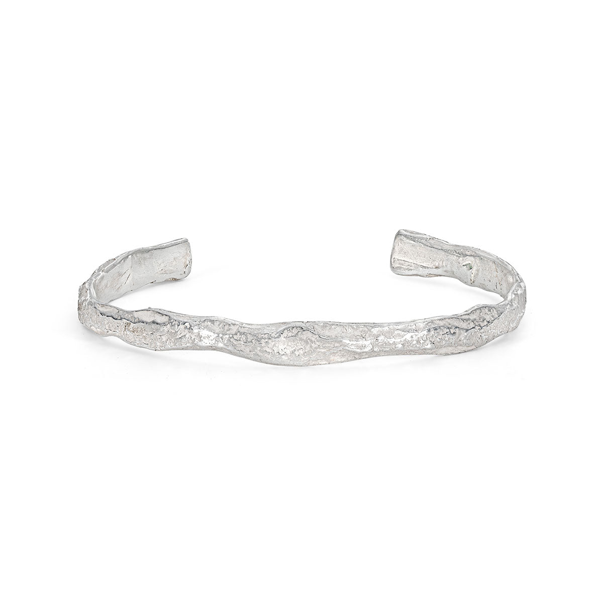 A tactile, sea-worn stirling silver cuff that looks like weathered rock under the ocean's surface. By Emily Nixon.