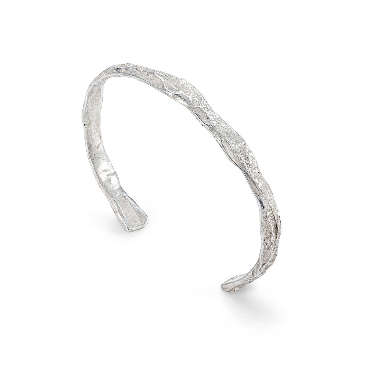 A tactile, sea-worn stirling silver cuff that looks like weathered rock under the ocean's surface. By Emily Nixon.